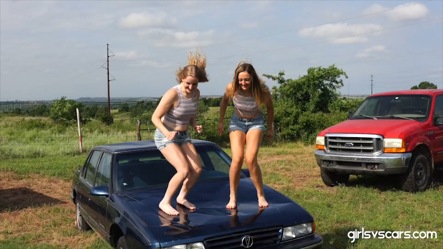 2 aspiring models pose and jump on a car